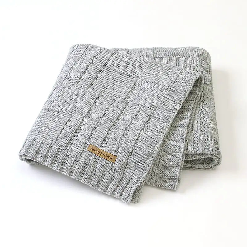 Manta de bebé tejida de color liso