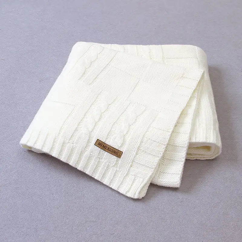 Manta de bebé tejida de color liso